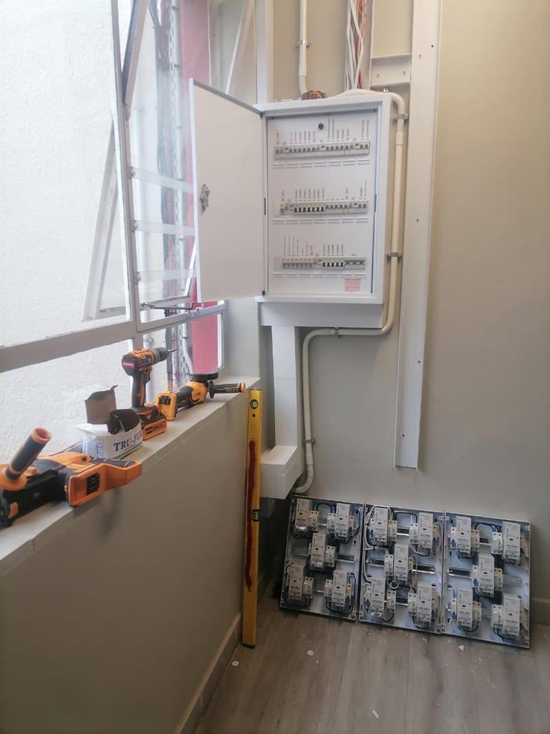 Distribution board installation in progress with tools on site