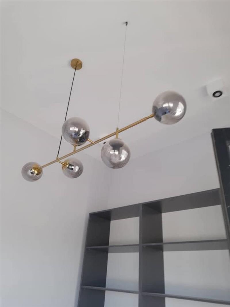 Modern feature light fitting installed on a ceiling