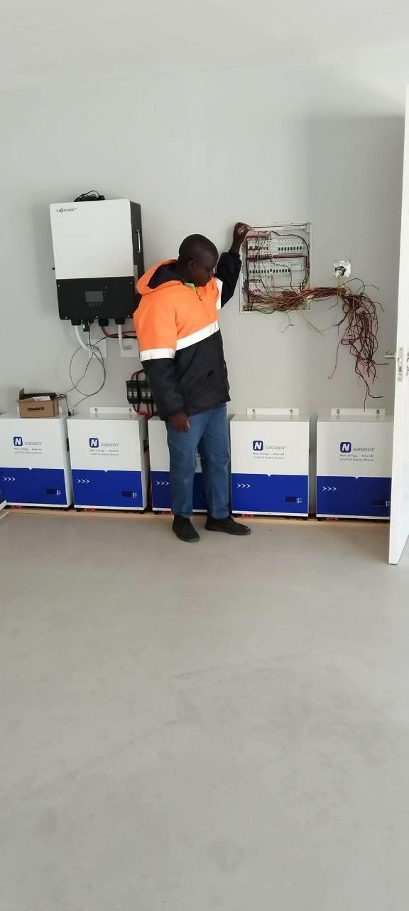 Inverter and battery installation with electrical wiring in progress