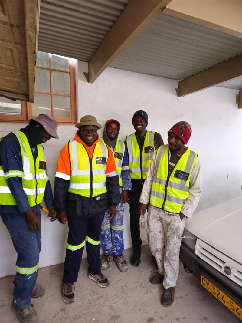 TK Honest Electrical team members on site in safety vests